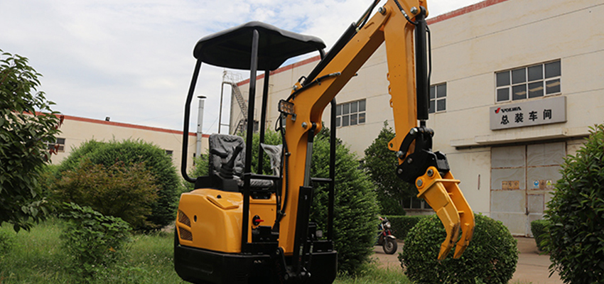 The ripper is installed on a small excavator